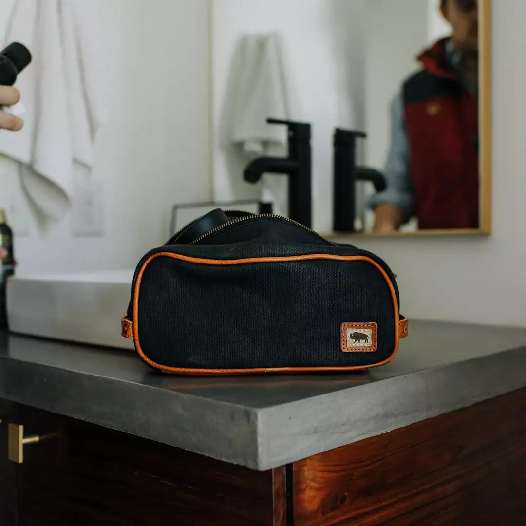 Buffalo Jackson Trading Co. Dakota Waxed Canvas Dopp Kit Toiletry Bag | Navy Charcoal W/ Saddle Tan Leather 7 Buffalo Jackson Trading Co. Dakota Waxed Canvas Dopp Kit Toiletry Bag | Navy Charcoal W/ Saddle Tan Leather